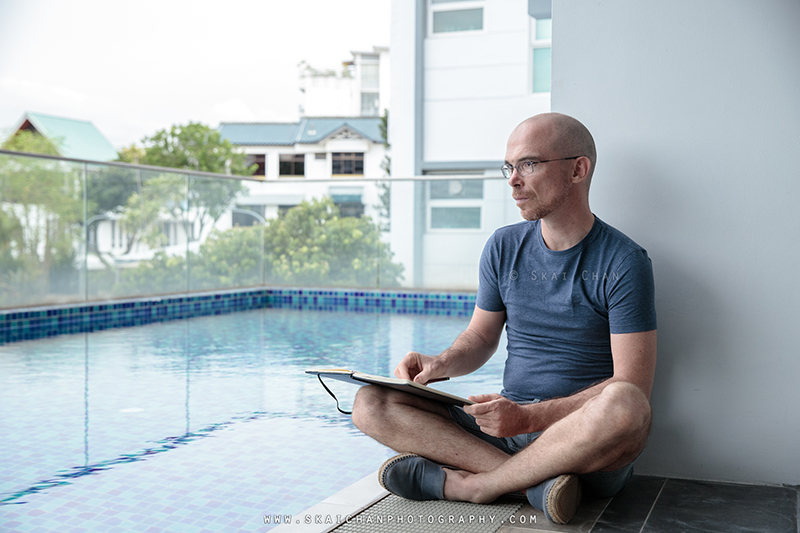 Artist sketching photoshoot session with Jerome Cheze at poolside (One Robey)